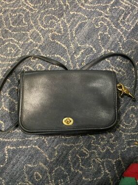 Elegant Black Leather Crossbody with Gold Turn-Lock
